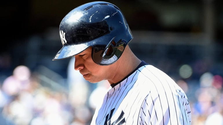 New York Yankees designated hitter Alex Rodriguez walks to the...