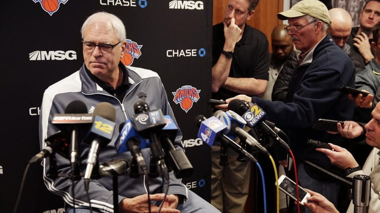 New York Knicks President Phil Jackson takes questions from reporters,...