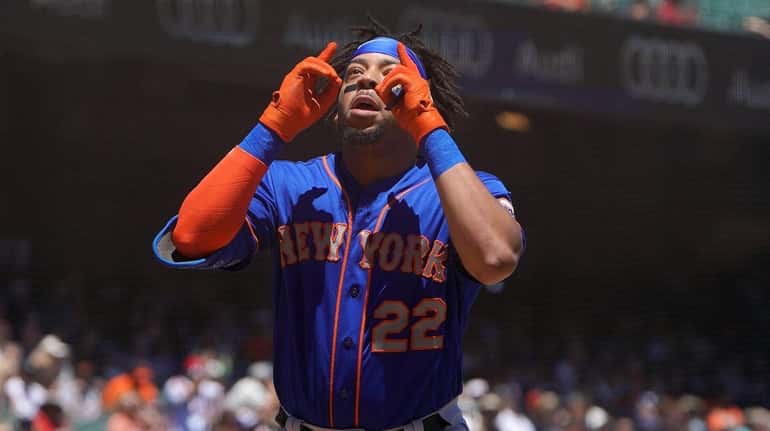 Dominic Smith, whose drop of a fly ball cost the...