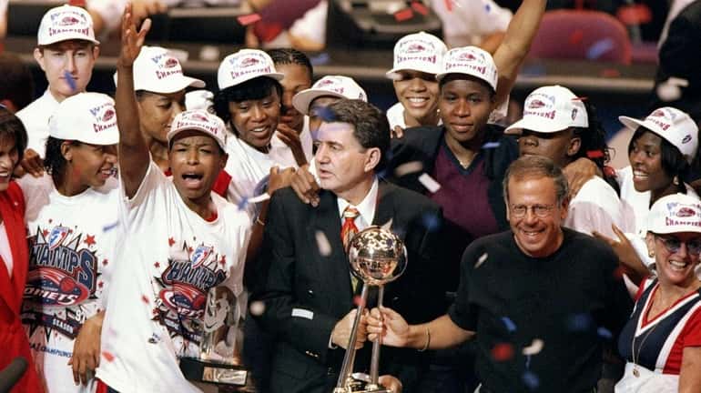 The Houston Comets celebrate after the WNBA championship game against...