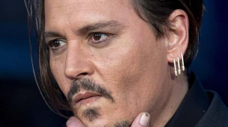 Johnny Depp attends the premiere of "Black Mass" during the...