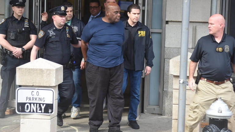Subway shooting suspect Frank James, 62, is led out of the...