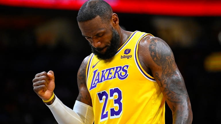 Los Angeles Lakers forward LeBron James clenches his fist after...
