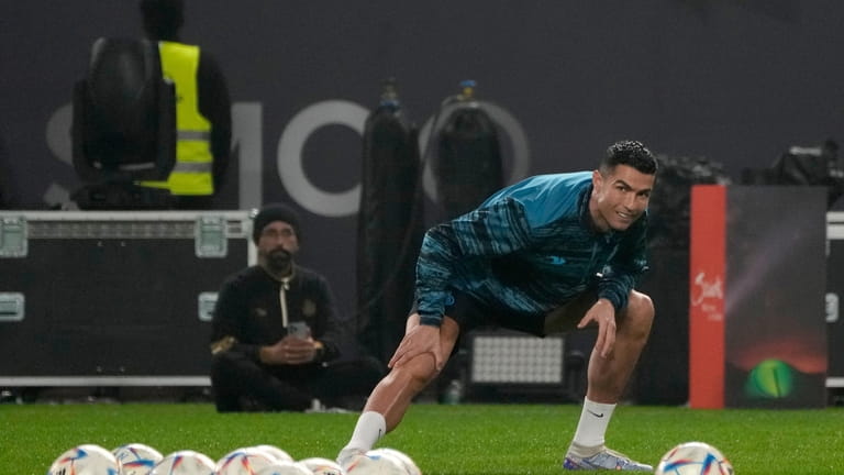 Cristiano Ronaldo, warms up during his first training after the...