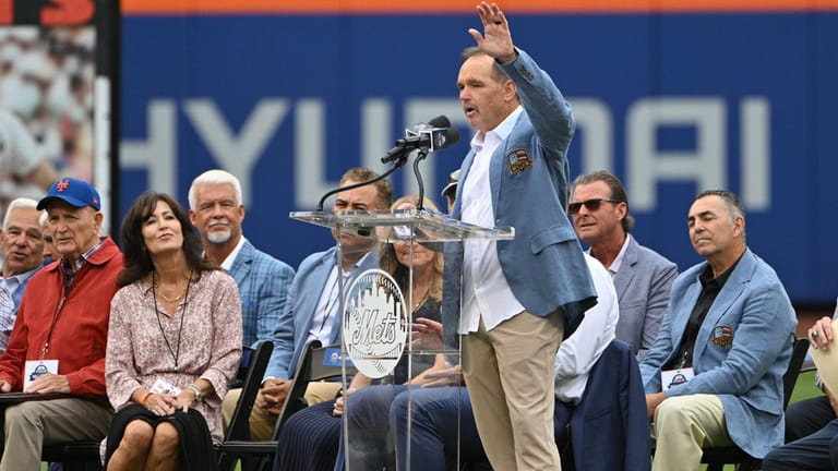 Former New York Mets Howard Johnson acknowledges fans during his...