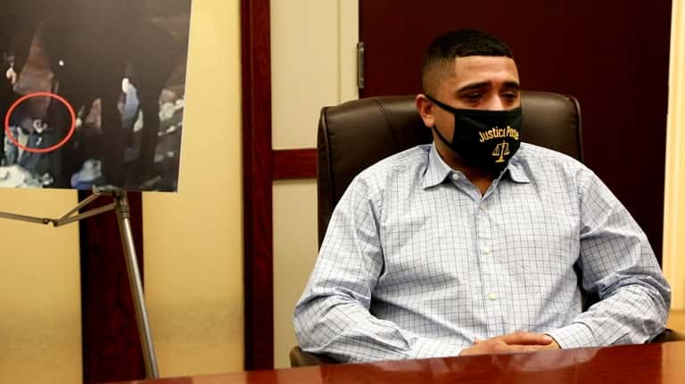 Christopher Cruz sitting at his lawyer's Frederick Brewingtont's office in Hempstead...