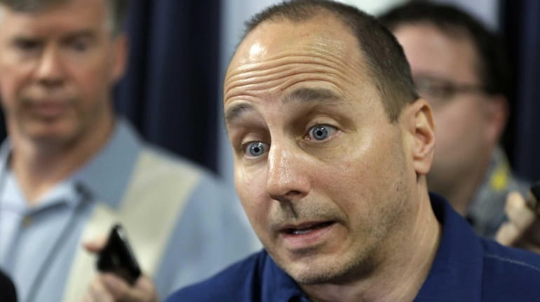 Yankees general manager Brian Cashman responds to a question about...