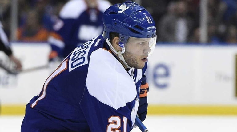 New York Islanders right wing Kyle Okposo skates with the...