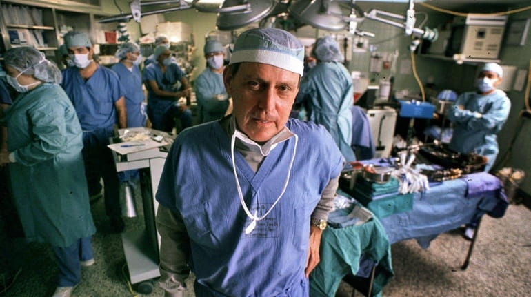 Transplant pioneer Dr. Thomas E. Starzl oversees a liver transplant...