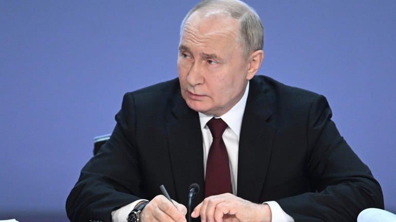Russian President Vladimir Putin attends the annual meeting of Russian...
