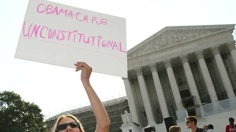 An Obamacare protester at the Supreme Court in an undated...