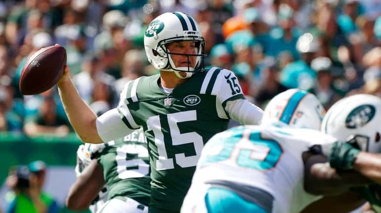 Josh McCown of the Jets throws a pass in the...