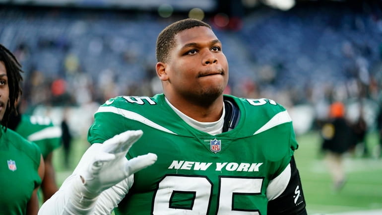 New York Jets' Quinnen Williams comes off the field after...