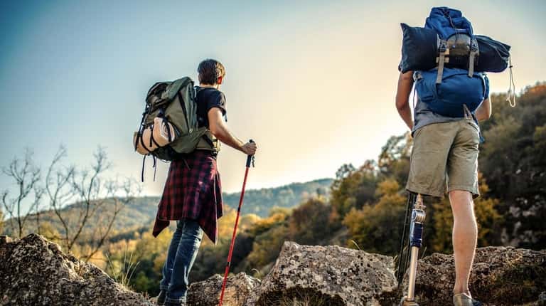 Two hiking buddies navigate a rocky nature trail.