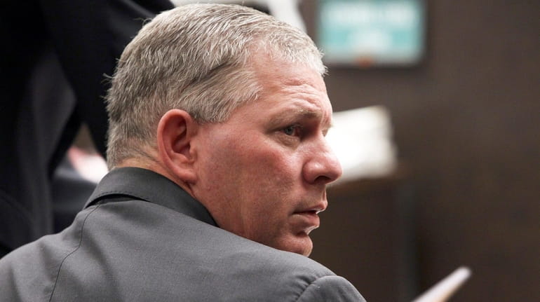 Former baseball player Lenny Dykstra sits during his sentencing for...