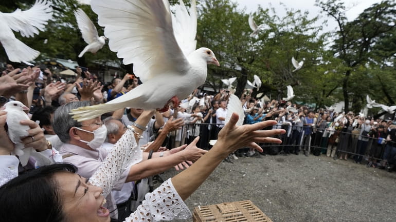 Doves are released in prayer of peace by worshippers at...