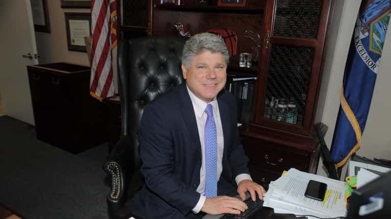 Judge Andrew Crecca in his Central Islip courthouse office.
