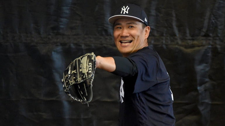 Yankees starter Masahiro Tanaka throws a bullpen session during spring...