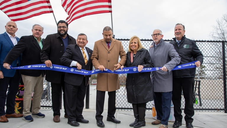 Assemb. Philip Ramos (D-Brentwood), joined by other officials, cuts the ribbon...