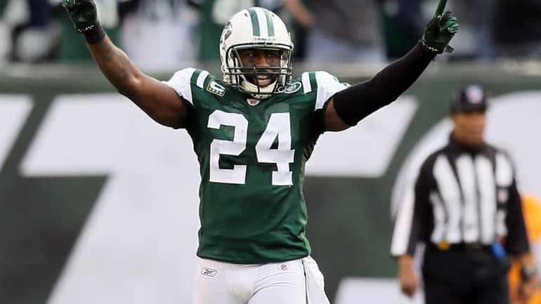 Darrelle Revis celebrates after the Jets took possession of the...