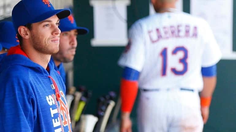 New York Mets starting pitcher Steven Matz looks on from...