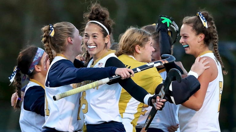 Northport players celebrate after defeating Shenendowa in the NYSPHSAA Class...