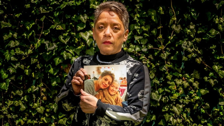 Debra Garofolo holds a photo of her late mother, Julie Toves,...