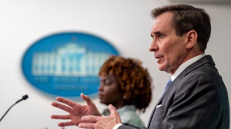 White House national security communications adviser John Kirby, right, accompanied...