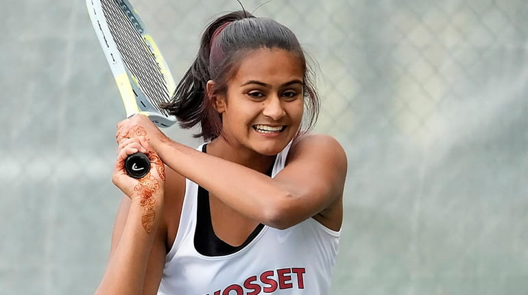 Syosset's first singles Eesha Kaushik with the backhand return during...