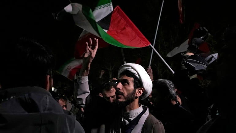 A cleric chants slogans during an anti-Israeli gathering in front...