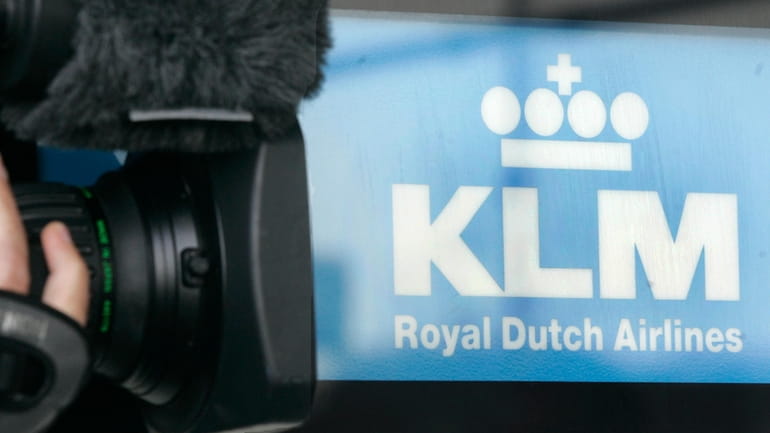 A cameraman films the Logo of Dutch airline KLM at...