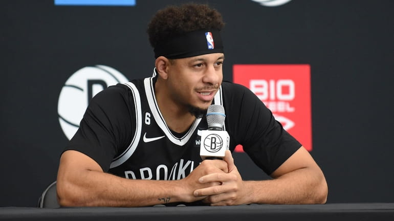 Seth Curry #30 of the Brooklyn Nets fields questions from...