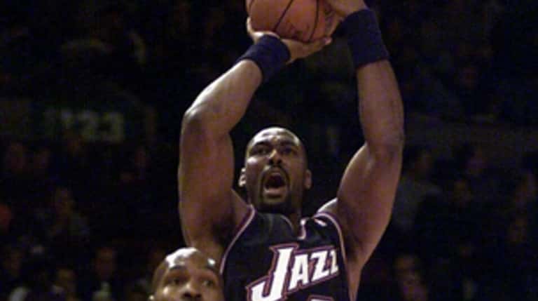 Karl Malone of Utah shoots in the first half against...