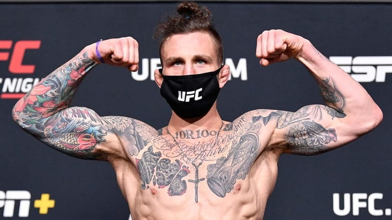 Gregor Gillespie poses on the scale during the UFC weigh-in...