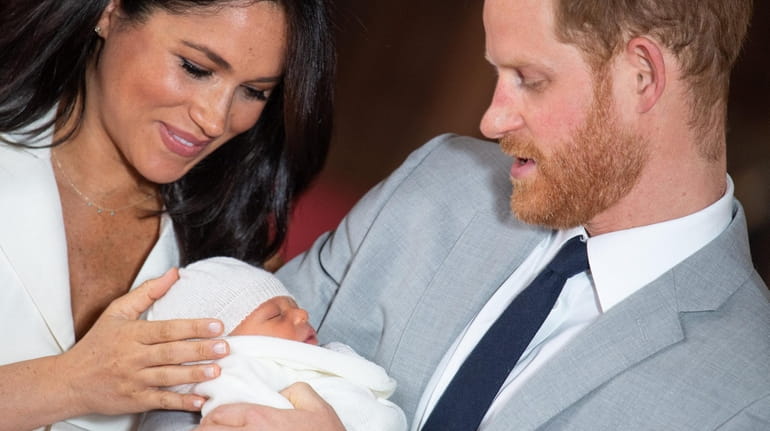 Meghan Markle and Prince Harry with their son, Archie Harrison...