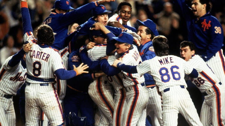 The New York Mets celebrate after winning game 7 of...