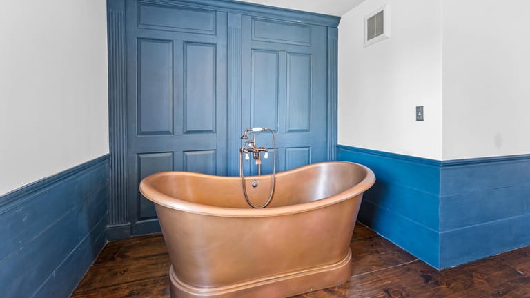 One of the home's two bathrooms contains a copper tub.