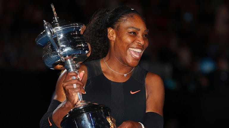 Serena Williams poses with the Daphne Akhurst Trophy after winning...