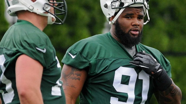 Jets DT Sheldon Richardson, right, participates in the team's second...