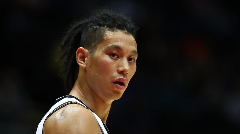 Jeremy Lin #7 of the Brooklyn Nets looks on against...