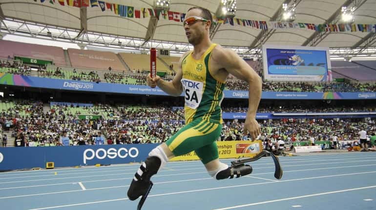 South Africa's Oscar Pistorius competes in a qualification round for...