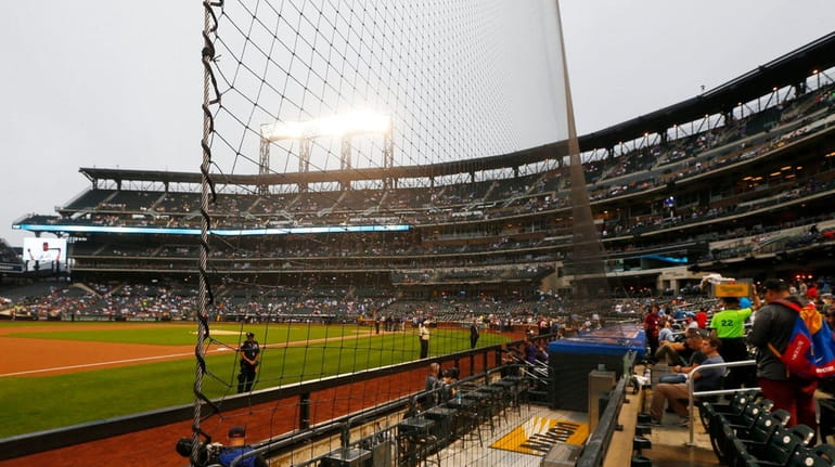 Newly installed safety netting on the third base line at...