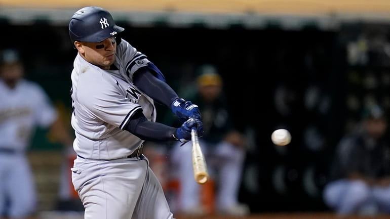 Yankees' Jose Trevino hits an RBI-double against the Oakland Athletics...