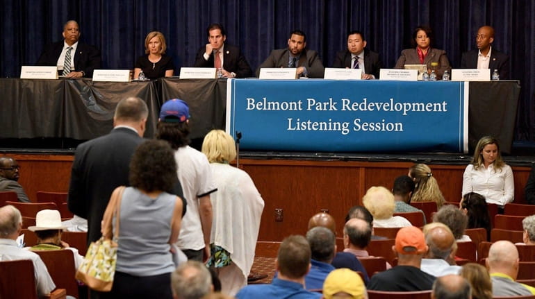 People line up to speak during a public listening session...