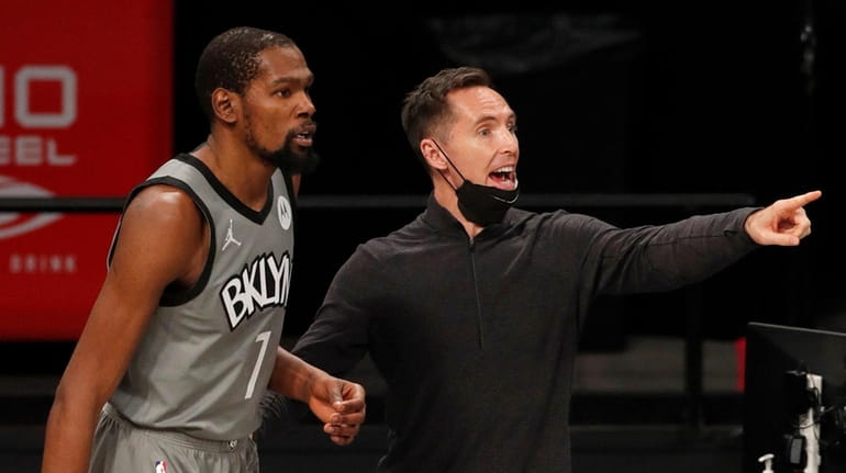 Nets head coach Steve Nash and Kevin Durant react late...