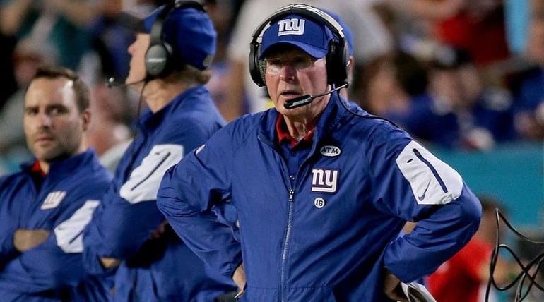 Giants coach Tom Coughlin took a big hit from cornerback...