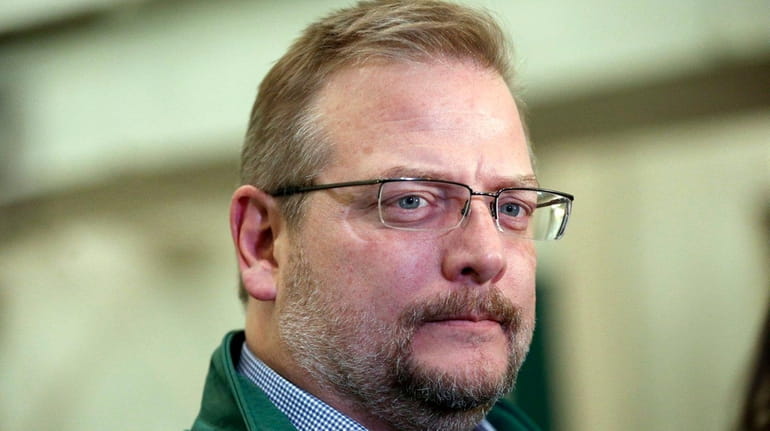 New York Jets general manager Mike Maccagnan speaks to reporters...
