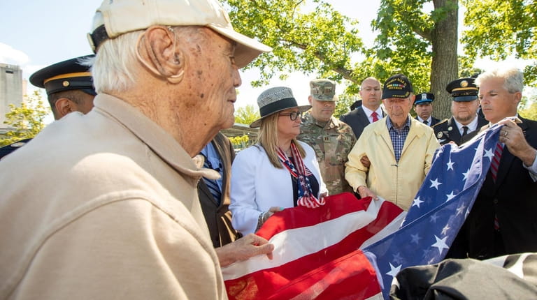 From left, World War II veteran James Carbone of Stony...
