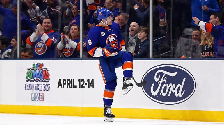 Islanders defenseman Ryan Pulock celebrates scoring a goal against the...