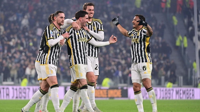 Juventus Turin's Dusan Vlahovic, third right, celebrates after scoring his...
